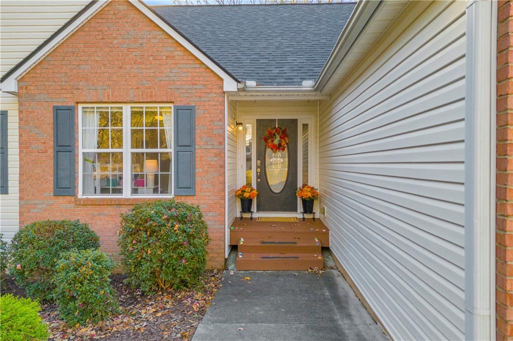 1670 Alcovy River Drive Dacula, GA 30019 - Photo 3 of 43 a front view of a house with a porch