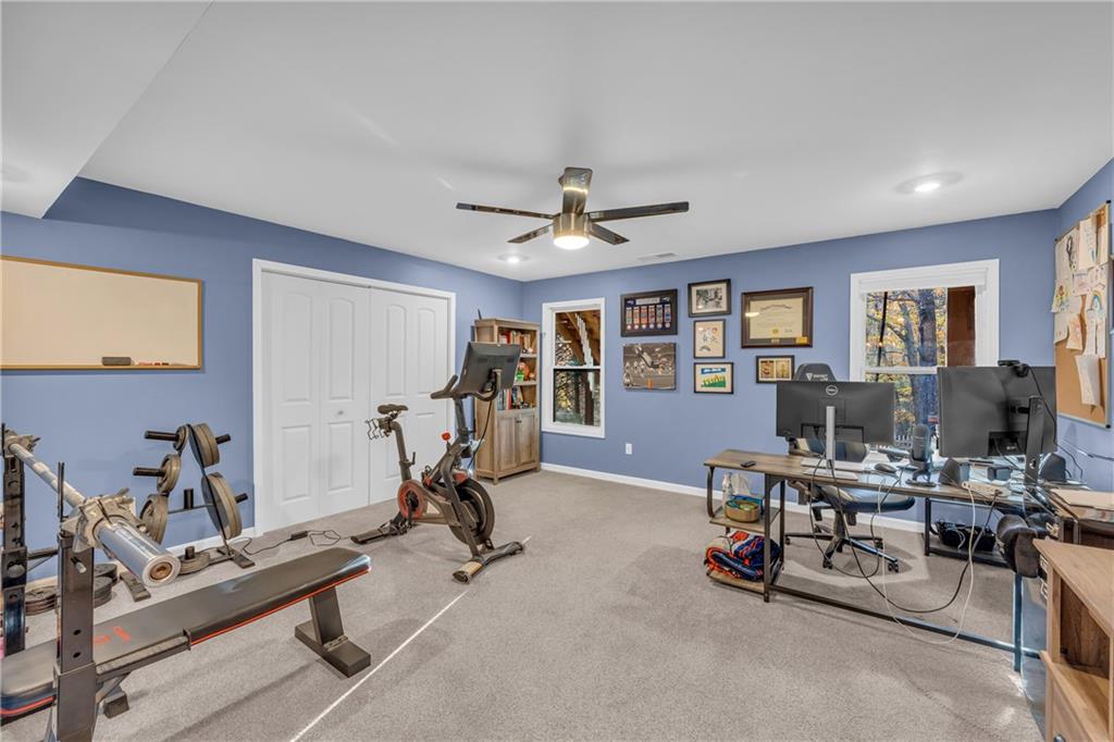 1670 Alcovy River Drive Dacula, GA 30019 - Photo 31 of 43 a view of a livingroom with workspace and a window
