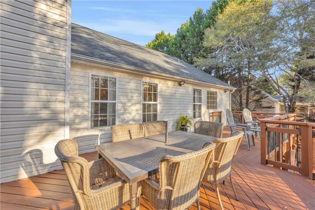 1670 Alcovy River Drive Dacula, GA 30019 - Photo 35 of 43 a patio with table and chairs and potted plants