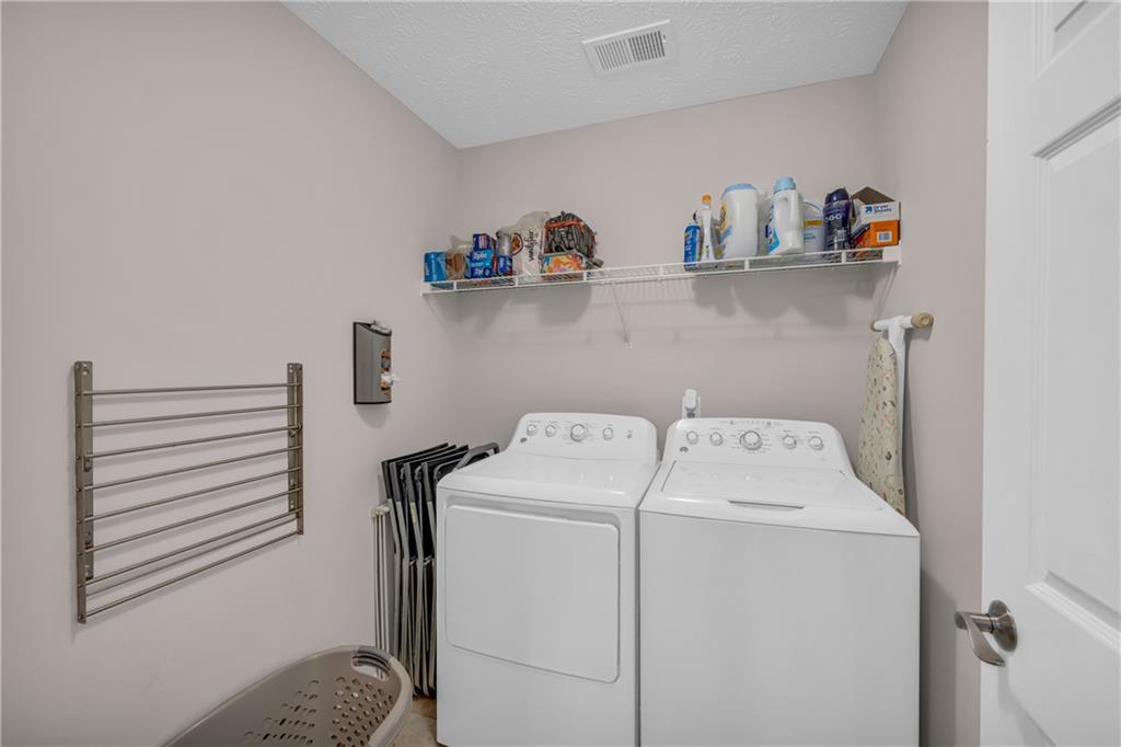 1670 Alcovy River Drive Dacula, GA 30019 - Photo 10 of 43 a utility room with dryer and washer