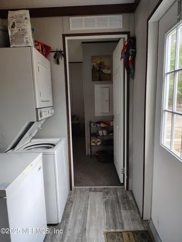 a bedroom with a bed chair and window