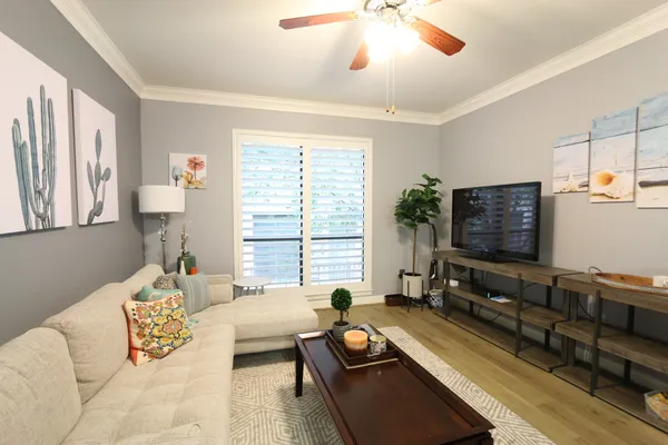a living room with furniture and a flat screen tv