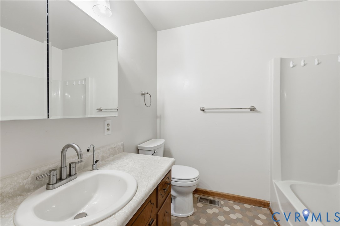 2521 Fort Lee Road Petersburg, VA 23805 - Photo 18 of 27 a bathroom with a sink toilet and shower