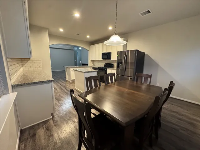 a view of a dining room with furniture