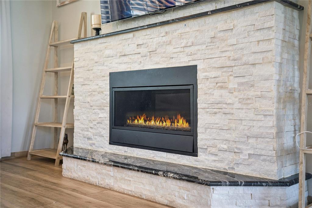 345 Cypress Isles Road Osteen, FL 32764 - Photo 12 of 41 a fireplace with a gate