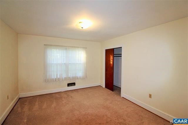 150 Bibb Store Road Louisa, VA 23093 - Photo 11 of 25 an empty room with a empty space and windows