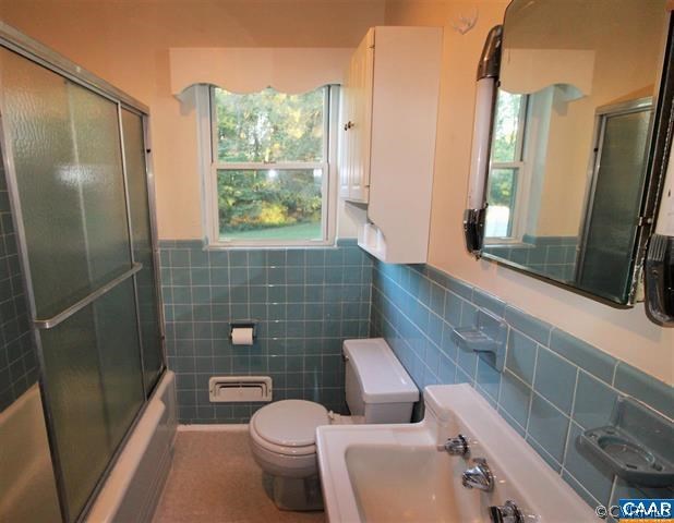 150 Bibb Store Road Louisa, VA 23093 - Photo 16 of 25 a bathroom with a toilet sink a mirror and shower