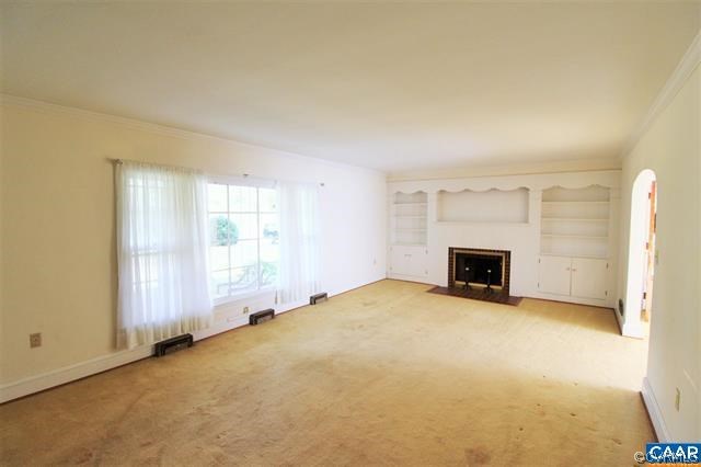 150 Bibb Store Road Louisa, VA 23093 - Photo 4 of 25 an empty room with a fireplace