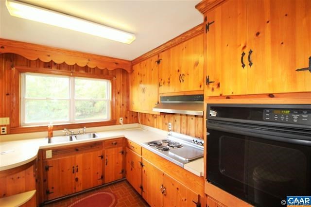 150 Bibb Store Road Louisa, VA 23093 - Photo 7 of 25 a kitchen with stainless steel appliances a sink and a stove