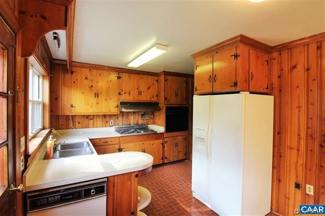 150 Bibb Store Road Louisa, VA 23093 - Photo 10 of 25 a kitchen with a refrigerator a stove and a microwave oven