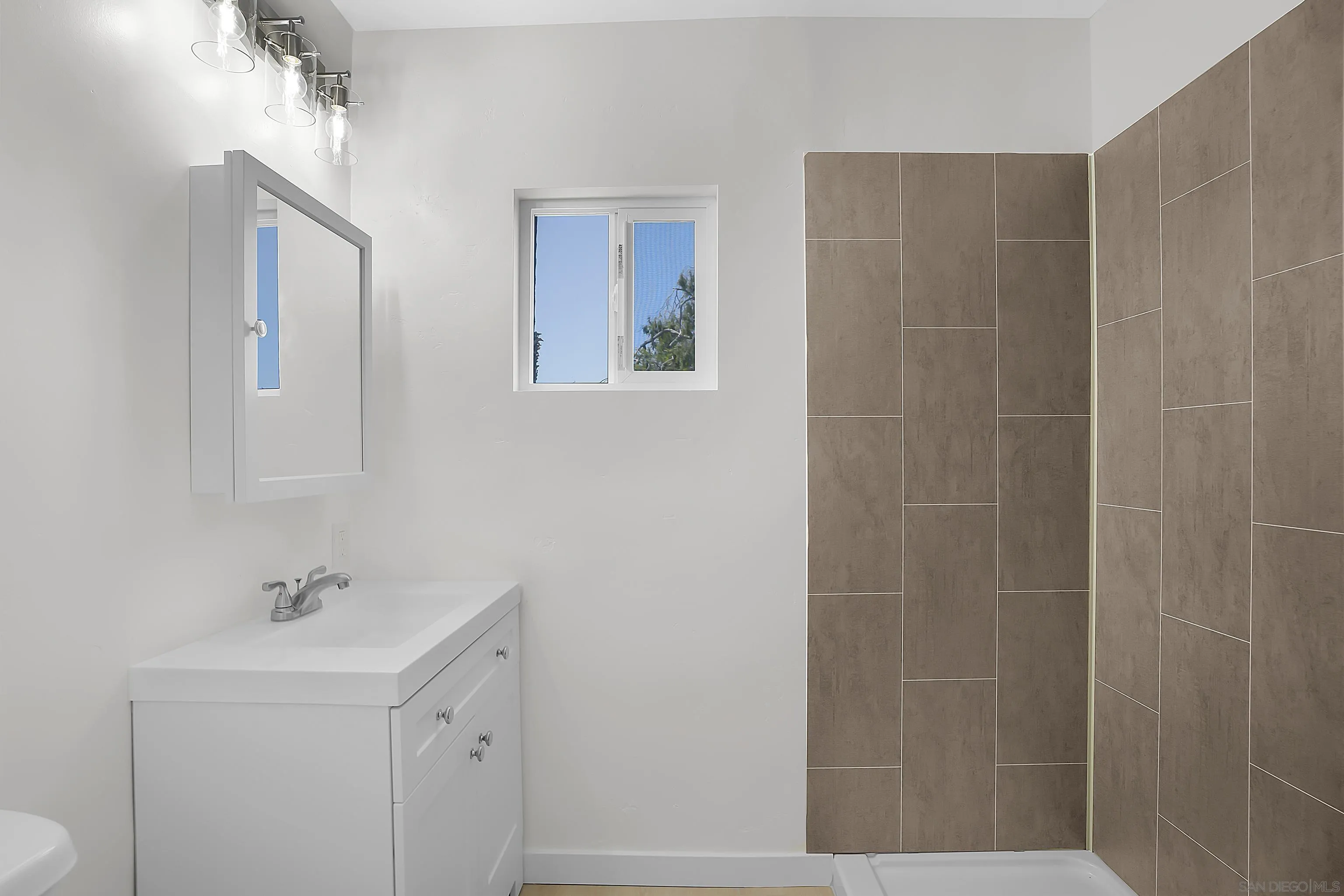 620 Elm Avenue Chula Vista, CA 91910 - Photo 11 of 30 a bathroom with a sink a toilet and shower