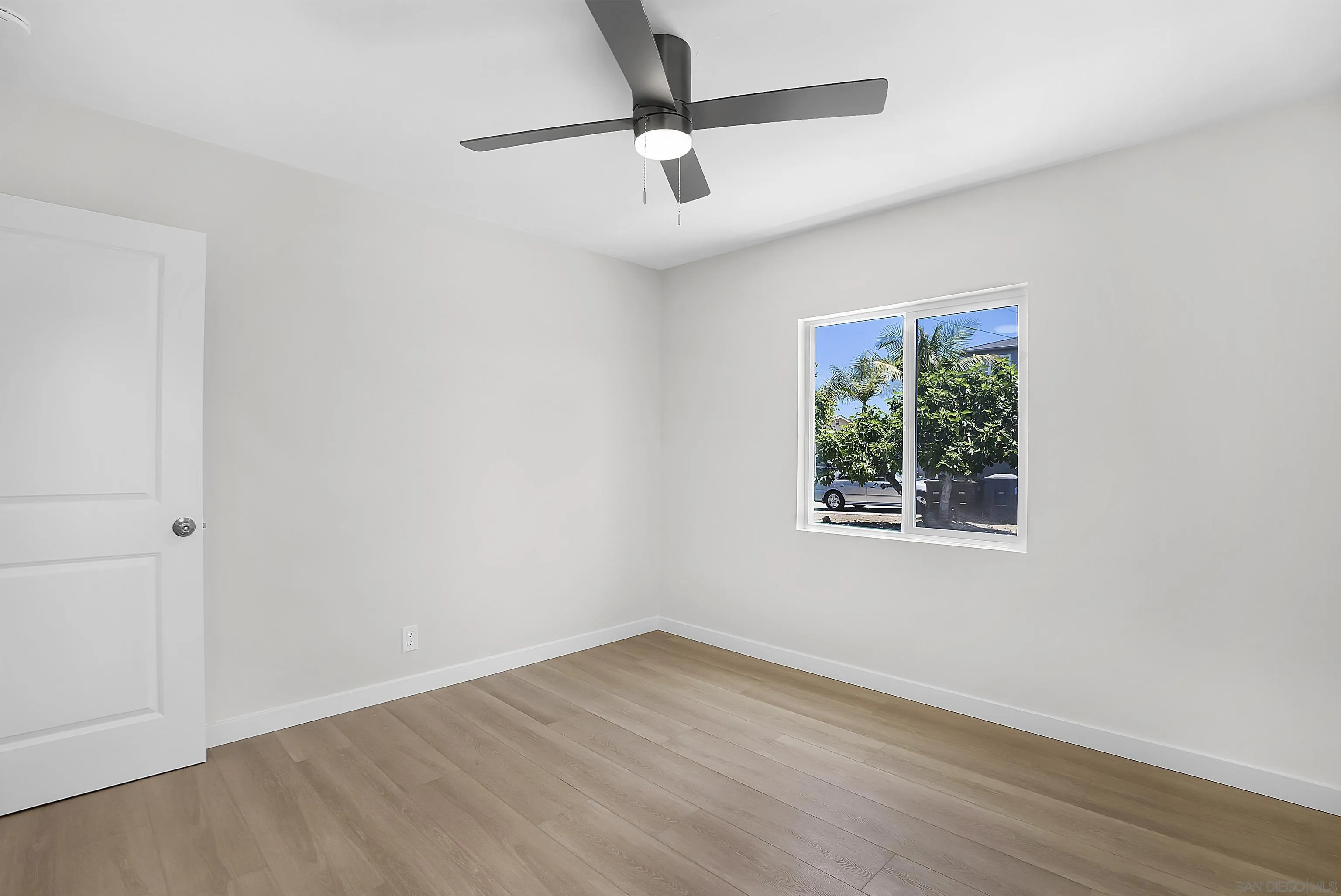 620 Elm Avenue Chula Vista, CA 91910 - Photo 15 of 30 an empty room with a window and a ceiling fan