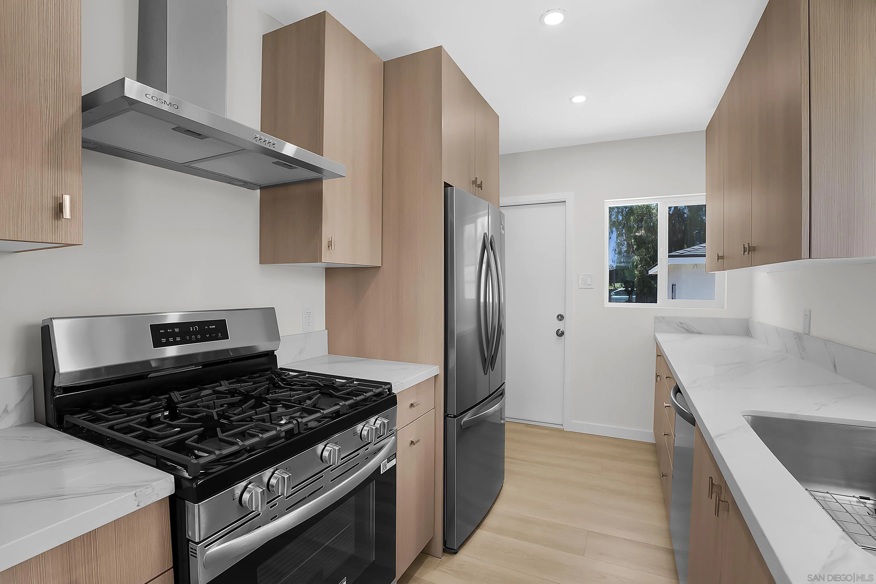 620 Elm Avenue Chula Vista, CA 91910 - Photo 23 of 30 a kitchen with stainless steel appliances granite countertop a refrigerator and a sink