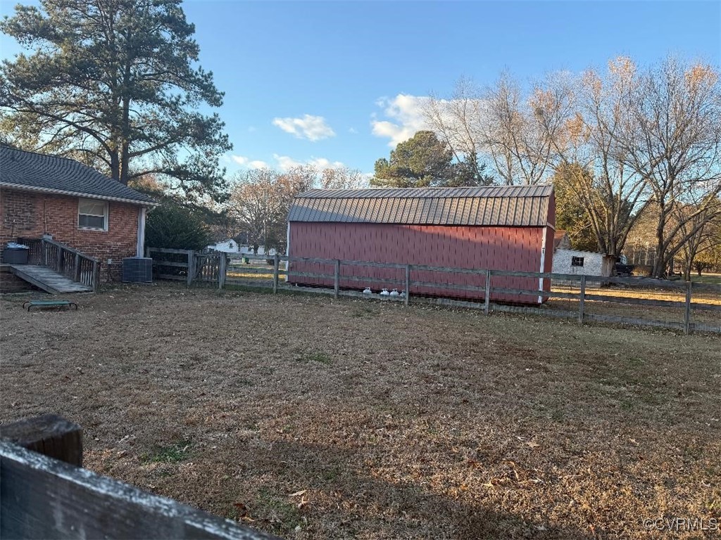 8155 Varina Road Henrico, VA 23231 - Photo 6 of 6 View of yard with cooling unit and an outbuilding