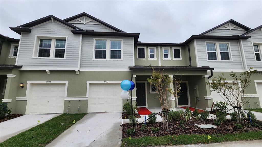 13756 Big Hawk Way Lithia, FL 33547 - Photo 1 of 1 a front view of a house with garden