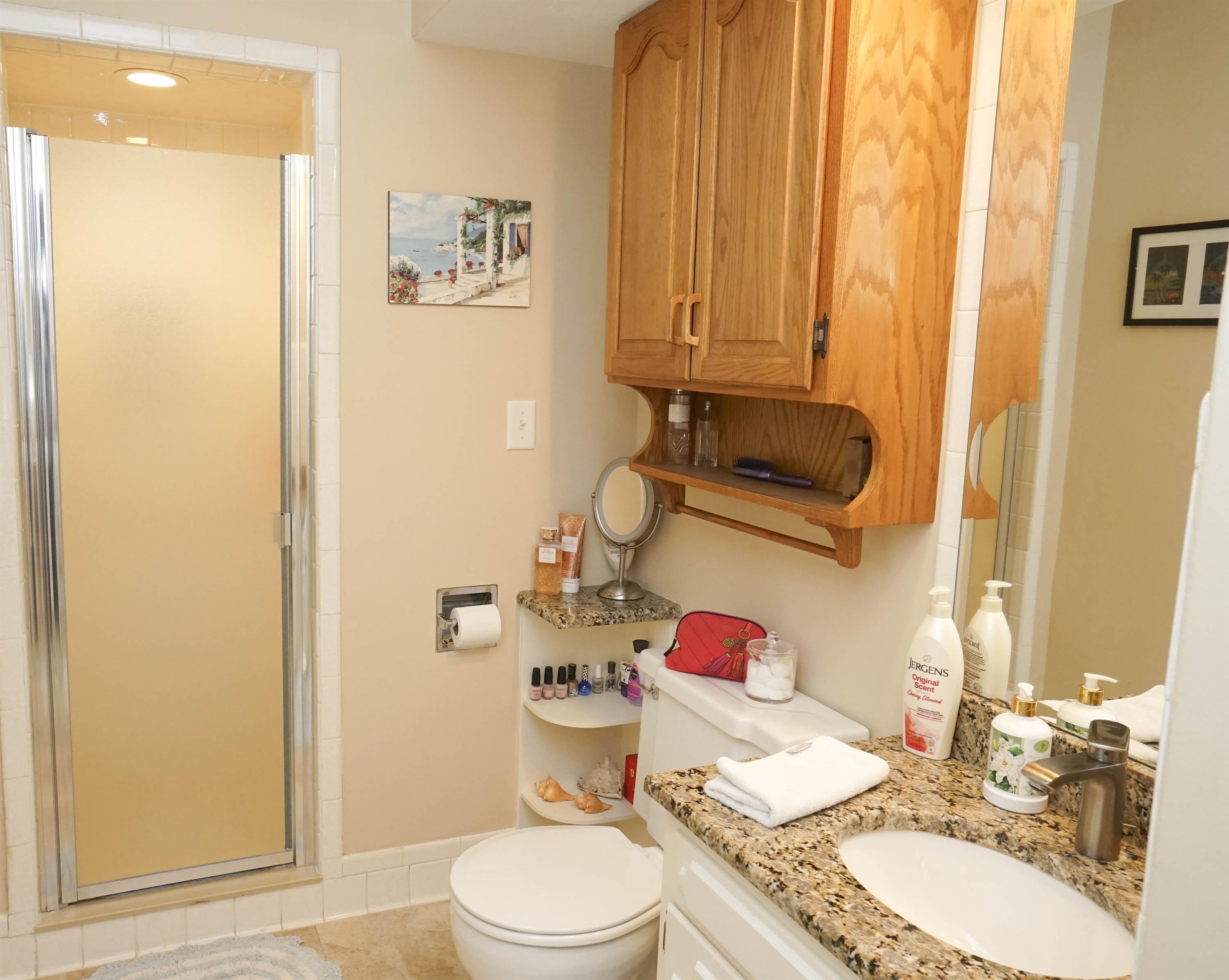 2707 Spring Creek Road Rockford, IL 61107 - Photo 23 of 44 a bathroom with a granite countertop sink and a mirror