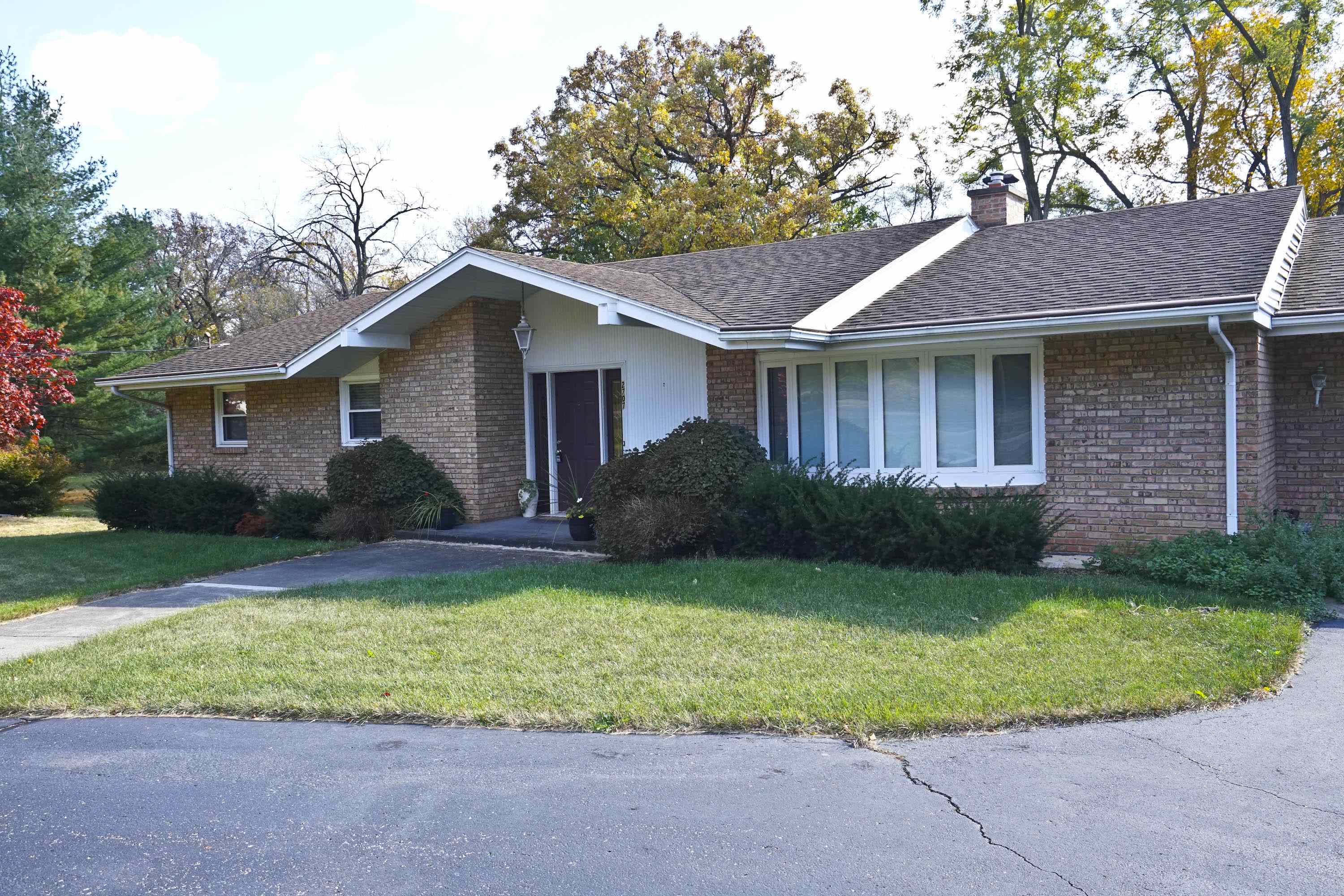 2707 Spring Creek Road Rockford, IL 61107 - Photo 3 of 44 a front view of house with yard and green space