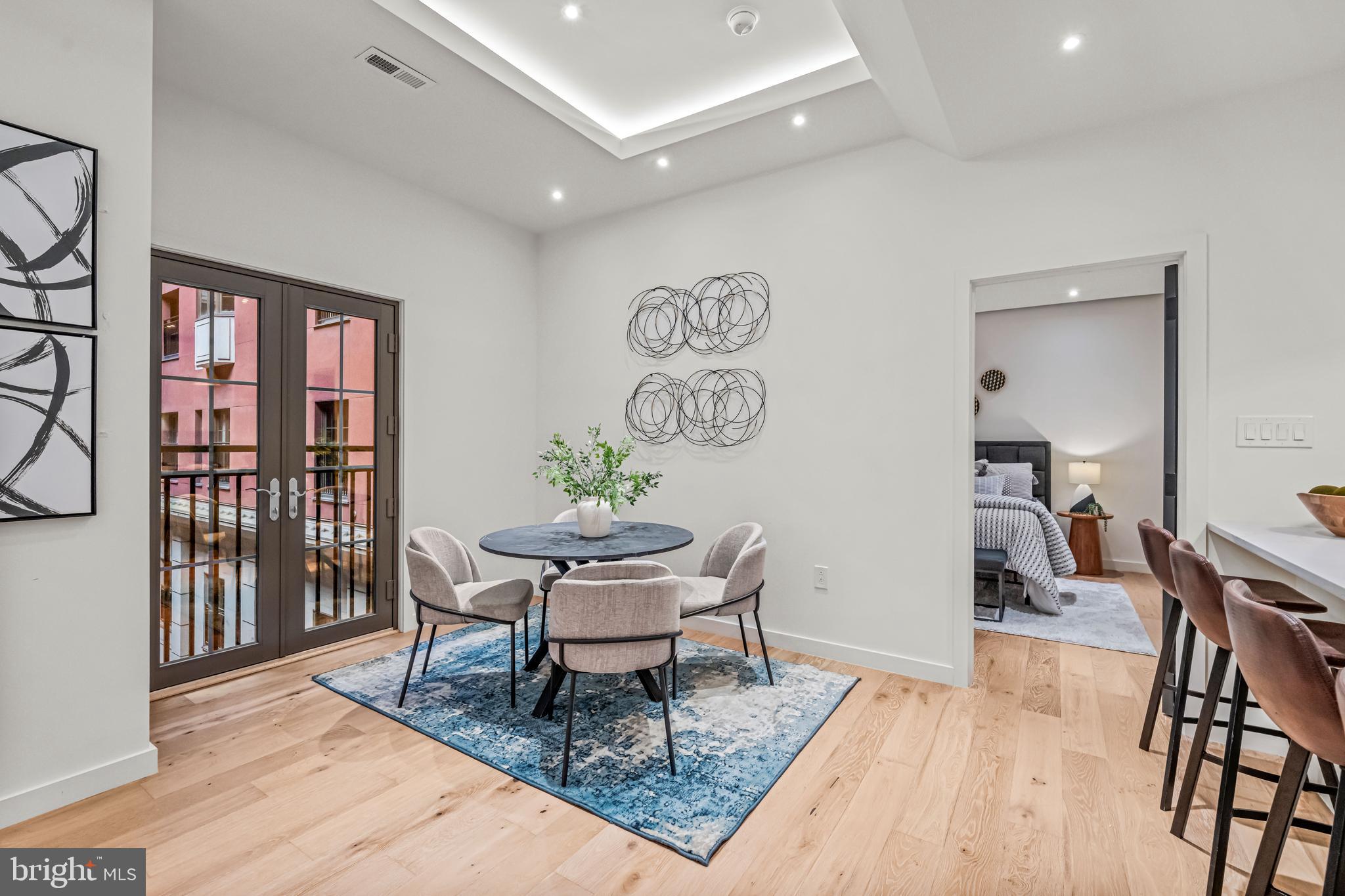 219 South 18th Street, Unit 309 Philadelphia, PA 19103 - Photo 17 of 44 a living room with furniture and a table