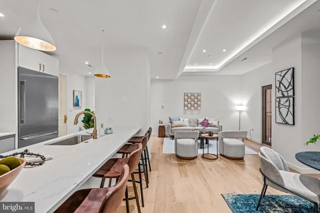 a kitchen with a table and chairs in it
