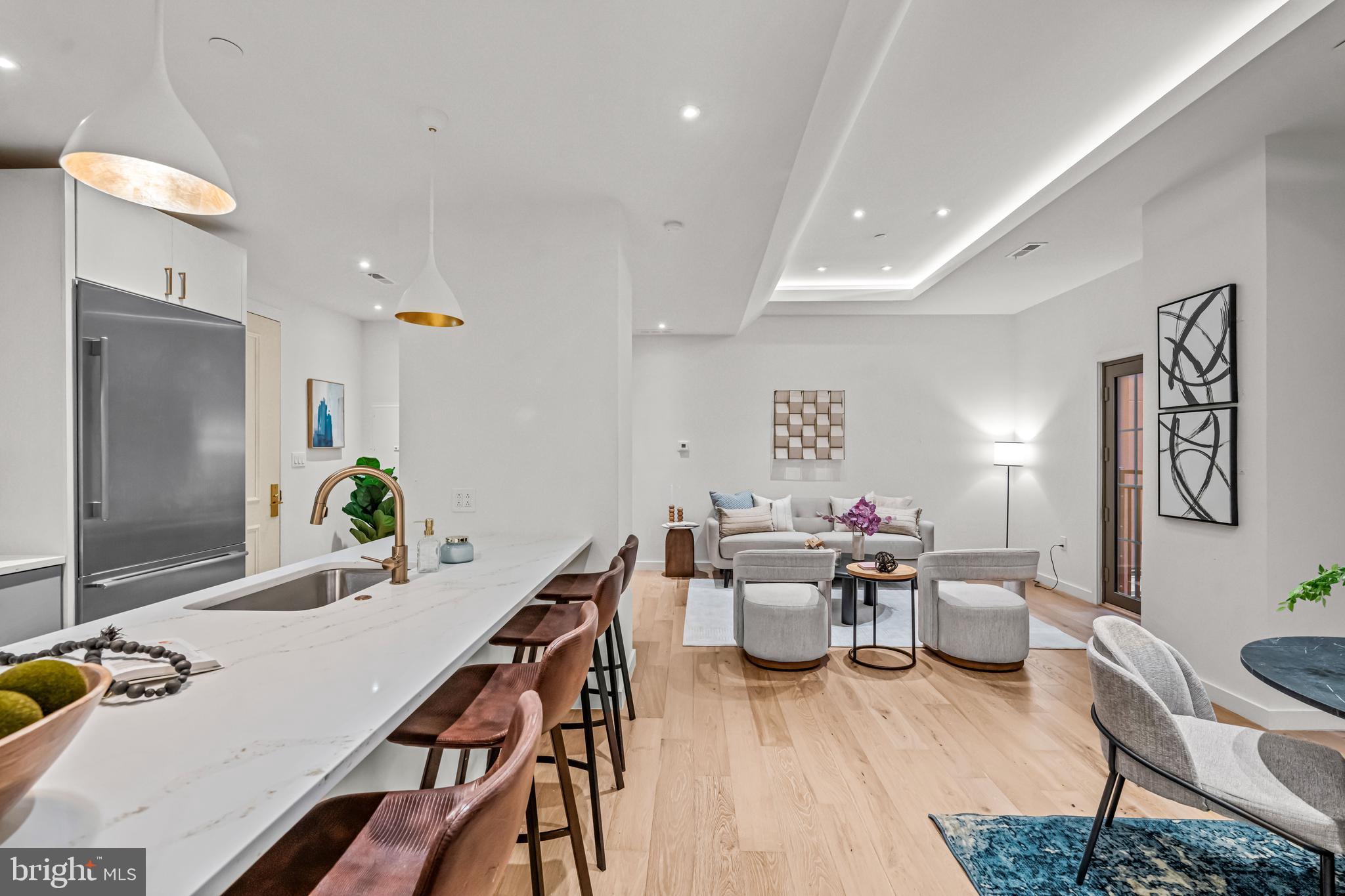 219 South 18th Street, Unit 309 Philadelphia, PA 19103 - Photo 19 of 44 a living room with furniture and wooden floor