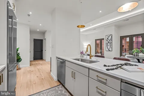 a kitchen with a sink and cabinets