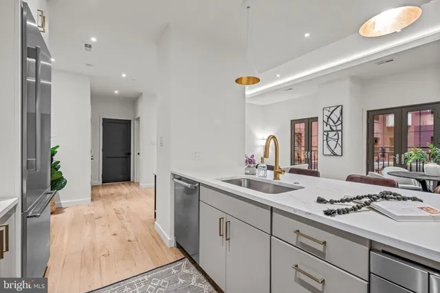 a kitchen with a sink and cabinets