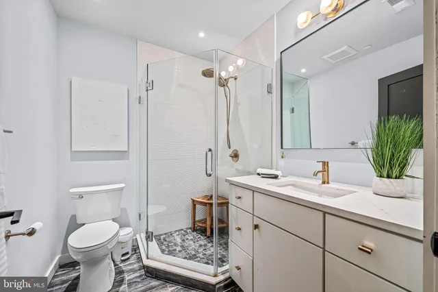a bathroom with a shower and a sink