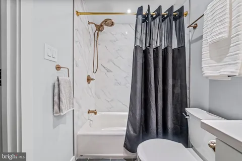 a view of a hallway with washer and dryer
