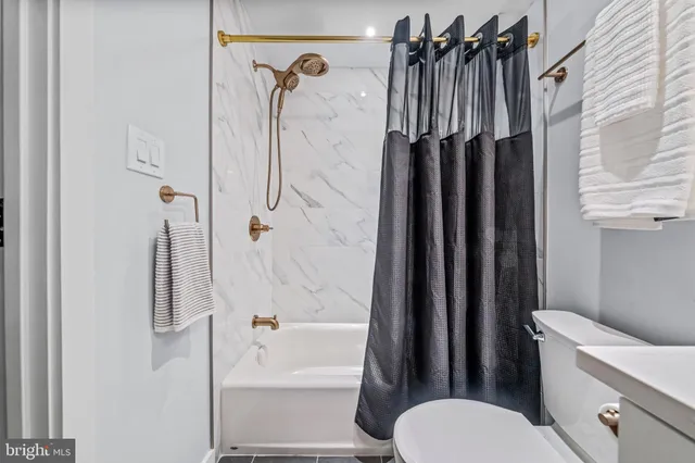 a view of a hallway with washer and dryer