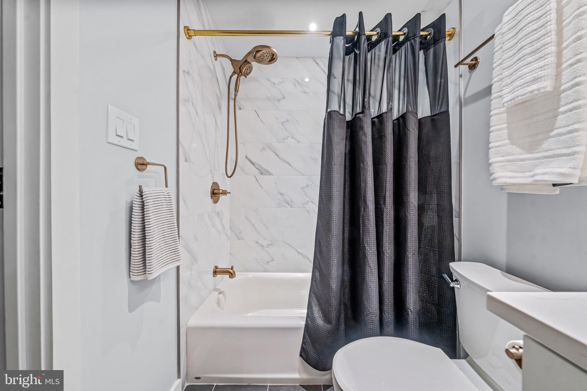 219 South 18th Street, Unit 309 Philadelphia, PA 19103 - Photo 35 of 44 a bathroom with a shower a toilet and a tub