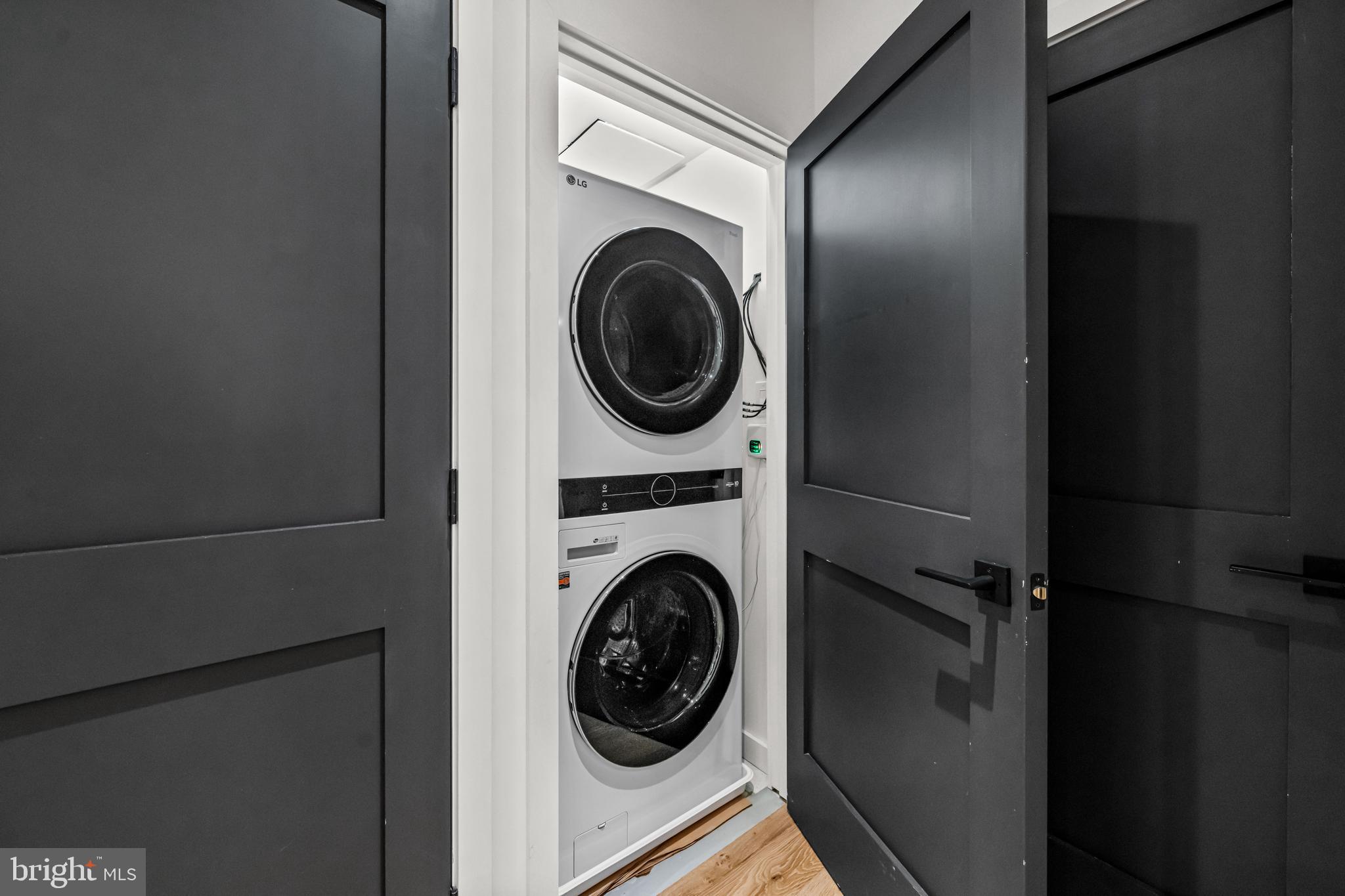 219 South 18th Street, Unit 309 Philadelphia, PA 19103 - Photo 36 of 44 a view of a hallway with washer and dryer
