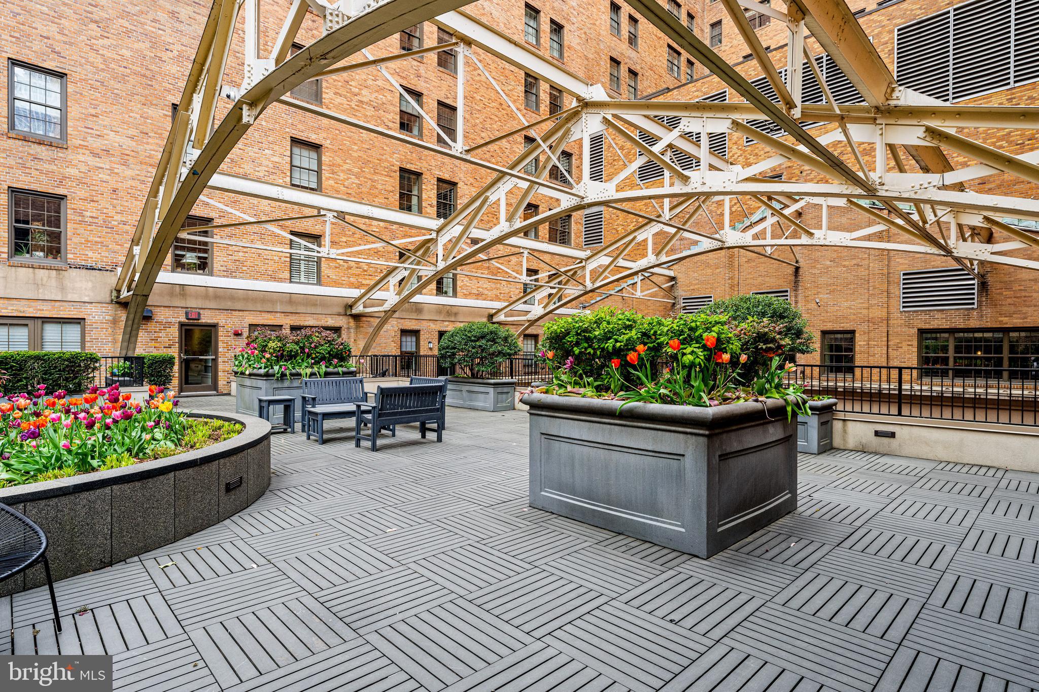 219 South 18th Street, Unit 309 Philadelphia, PA 19103 - Photo 39 of 44 a view of a patio with a dining table and chairs
