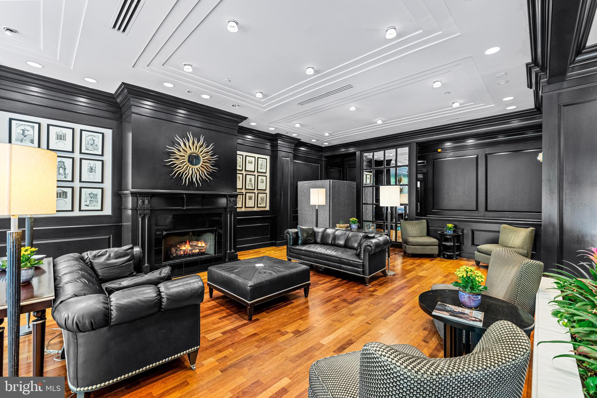 219 South 18th Street, Unit 309 Philadelphia, PA 19103 - Photo 6 of 44 a living room with furniture and a fireplace