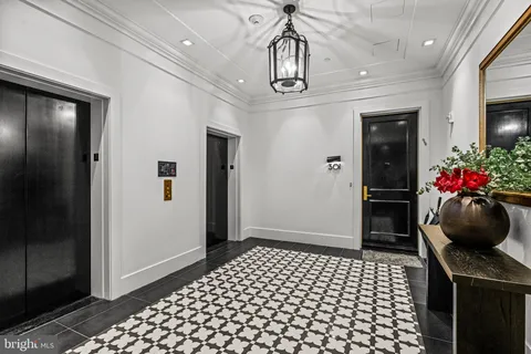 a view of hallway with wooden floor
