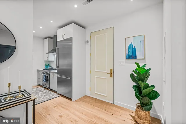 a workspace with furniture and a potted plant