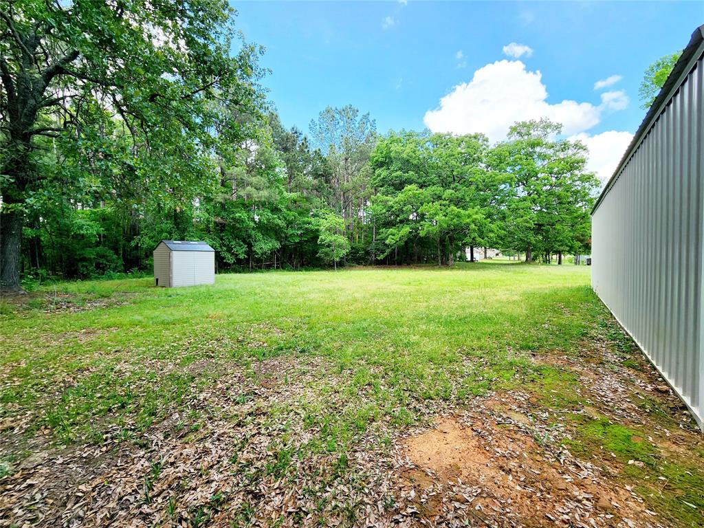 3514 Buchanan Loop Road Texarkana, TX 75501 - Photo 39 of 40 a view of a garden with a building in the background
