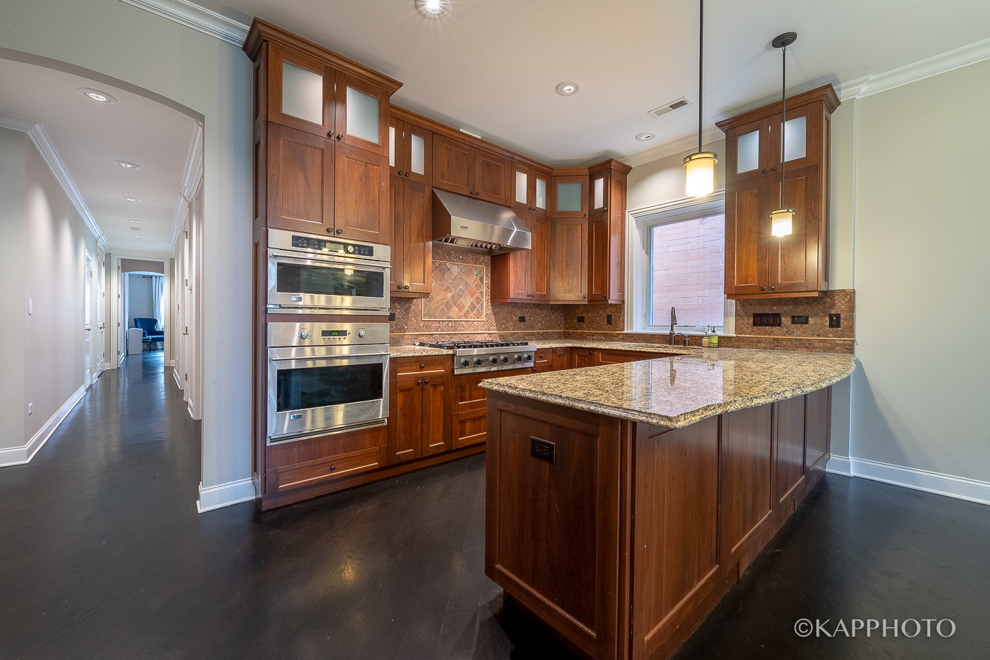 106 South Sangamon Street, Unit 3N Chicago, IL 60607 - Photo 13 of 27 a kitchen with stainless steel appliances granite countertop a sink a stove and a wooden floors