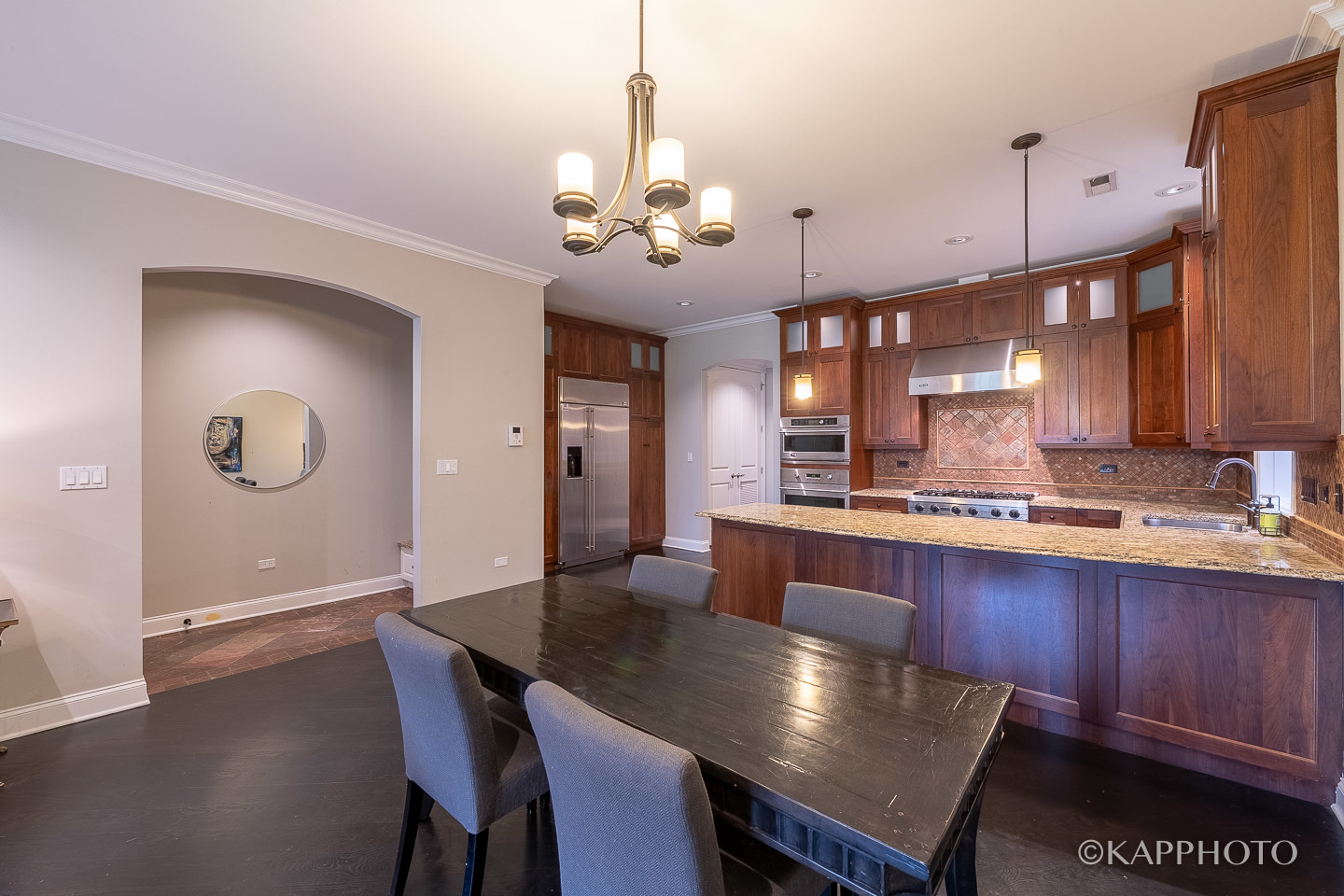 106 South Sangamon Street, Unit 3N Chicago, IL 60607 - Photo 9 of 27 a view of a dining room and a kitchen with a table chairs