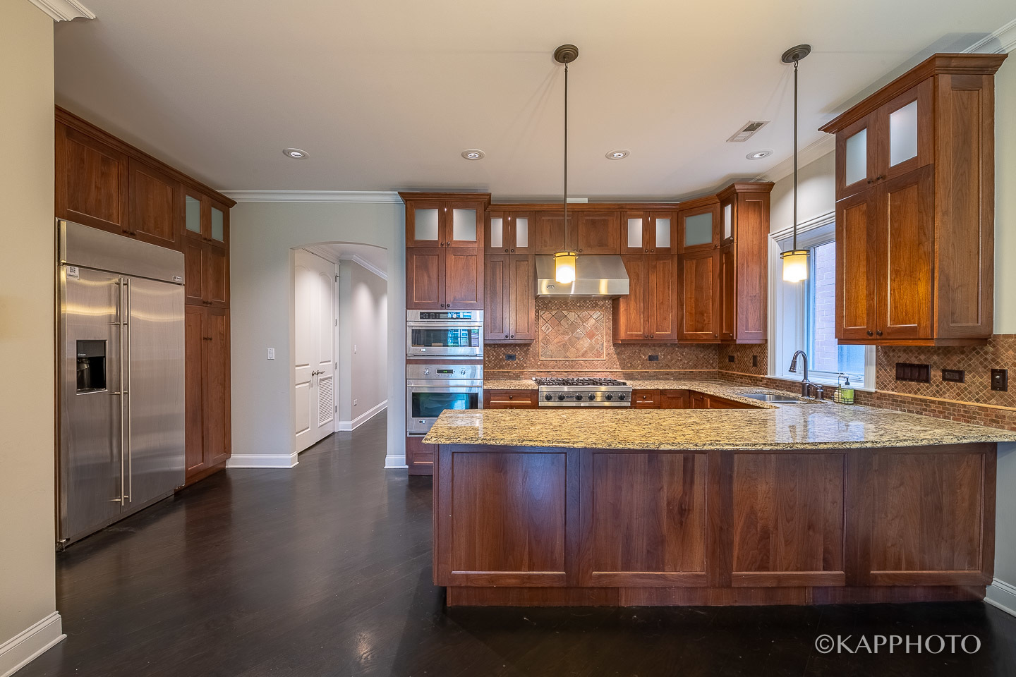 106 South Sangamon Street, Unit 3N Chicago, IL 60607 - Photo 10 of 27 a view of a kitchen with stainless steel appliances granite countertop a stove a refrigerator and a wooden floors