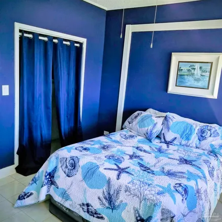 a bathroom with a sink a toilet and shower curtain