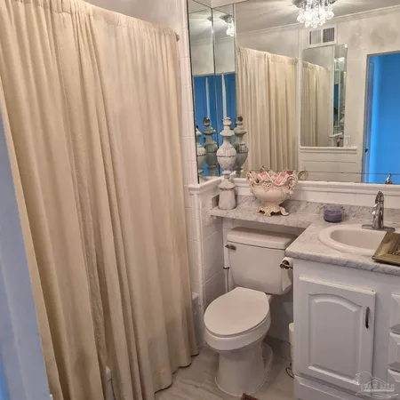 a kitchen with stainless steel appliances granite countertop a stove refrigerator sink and cabinets