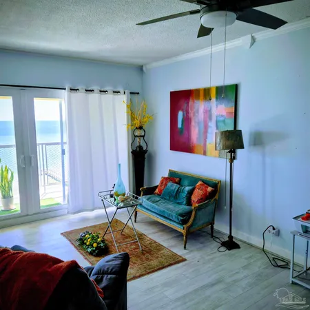a living room with furniture and a rug