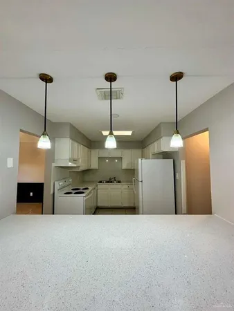 a view of a room with a chandelier