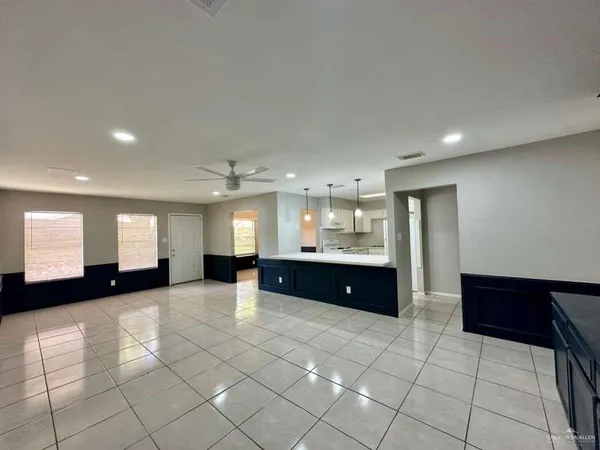 a large bathroom with a large tub and sink