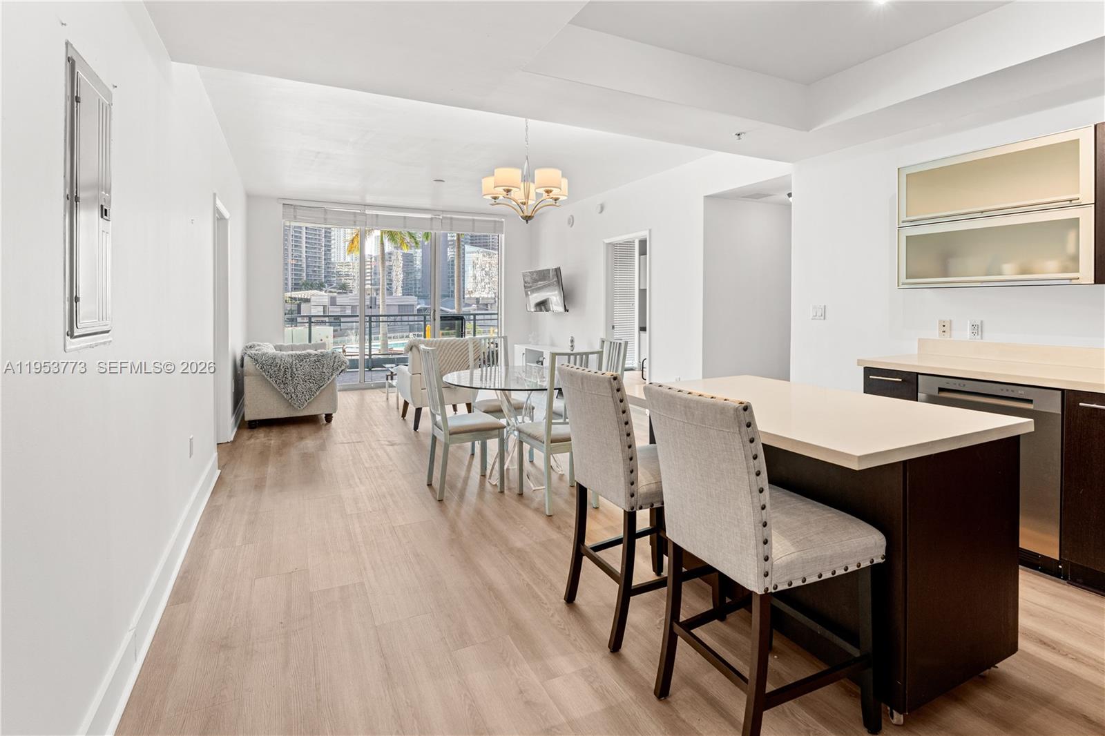 a view of a dining room with furniture and wooden floor
