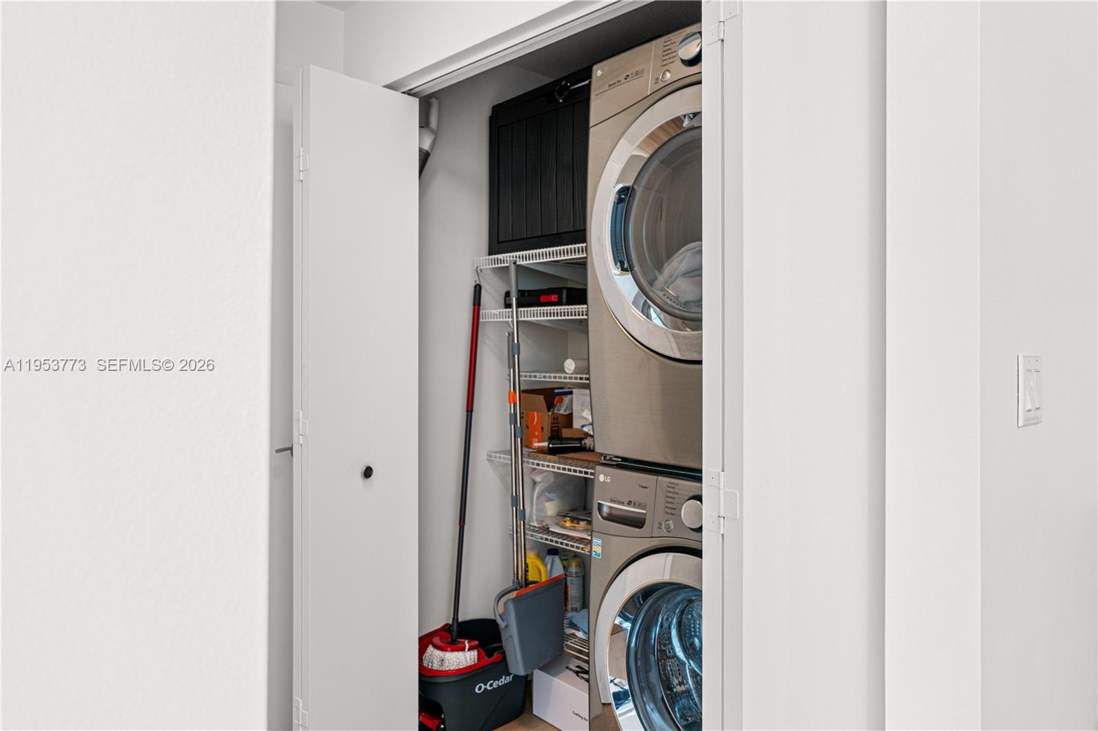 90 Southwest 3rd Street, Unit 1115 Miami, FL 33130 - Photo 13 of 17 a view of walk in closet with clothes and shoes