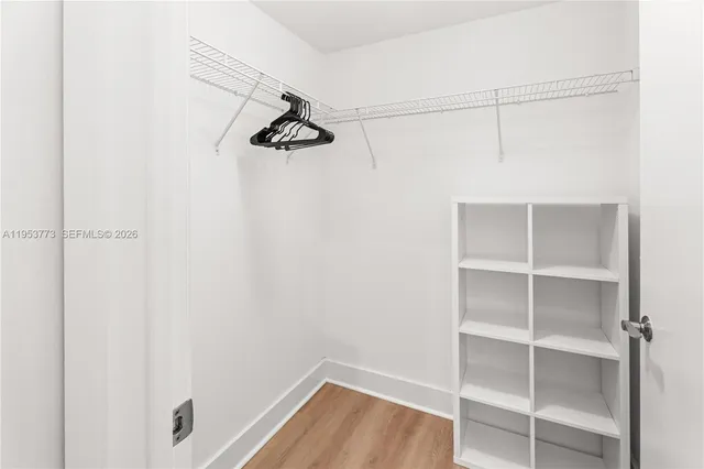 a view of a room with shelf on the wall