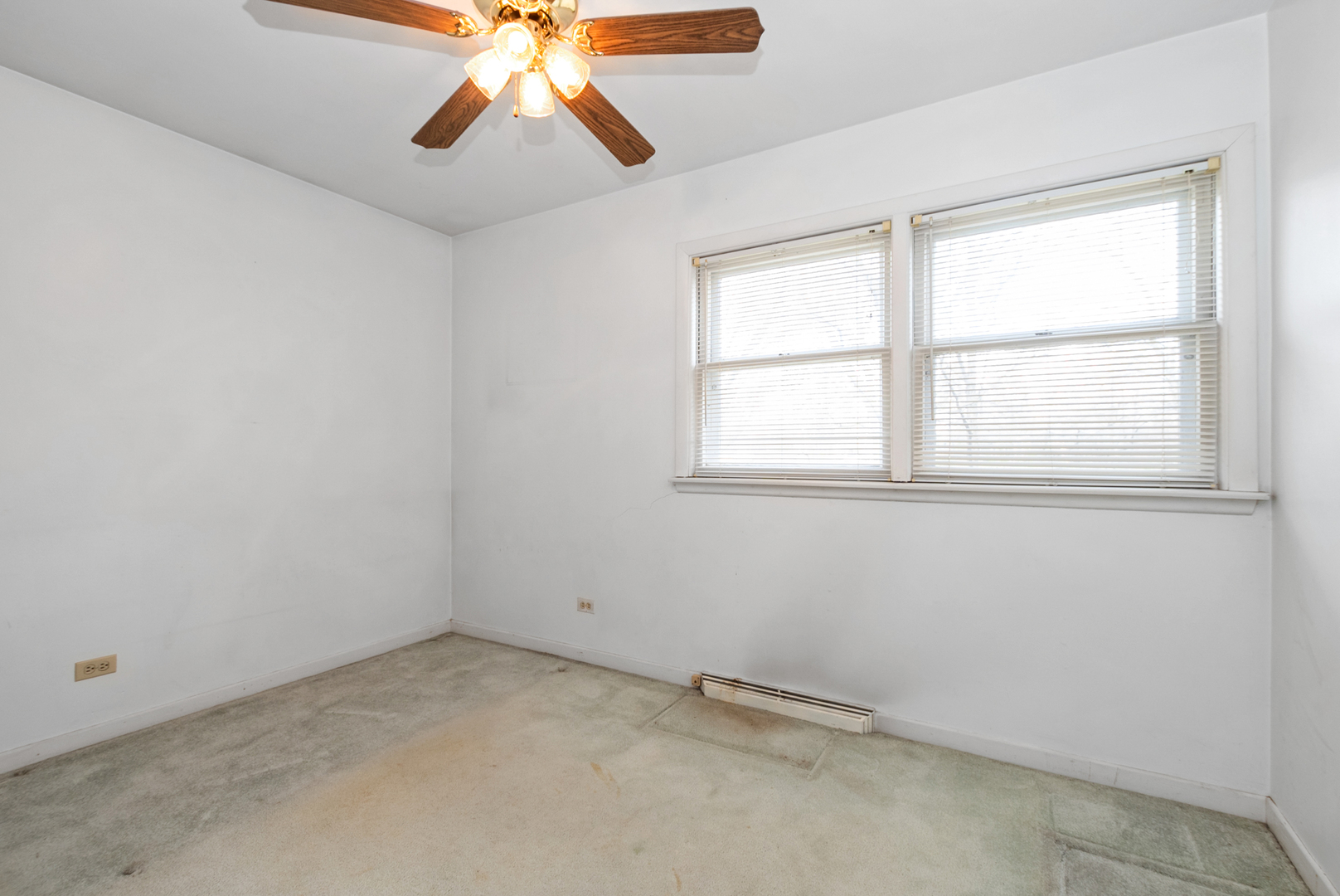 20009 East Brightway Road Mokena, IL 60448 - Photo 25 of 37 an empty room with chandelier fan and windows