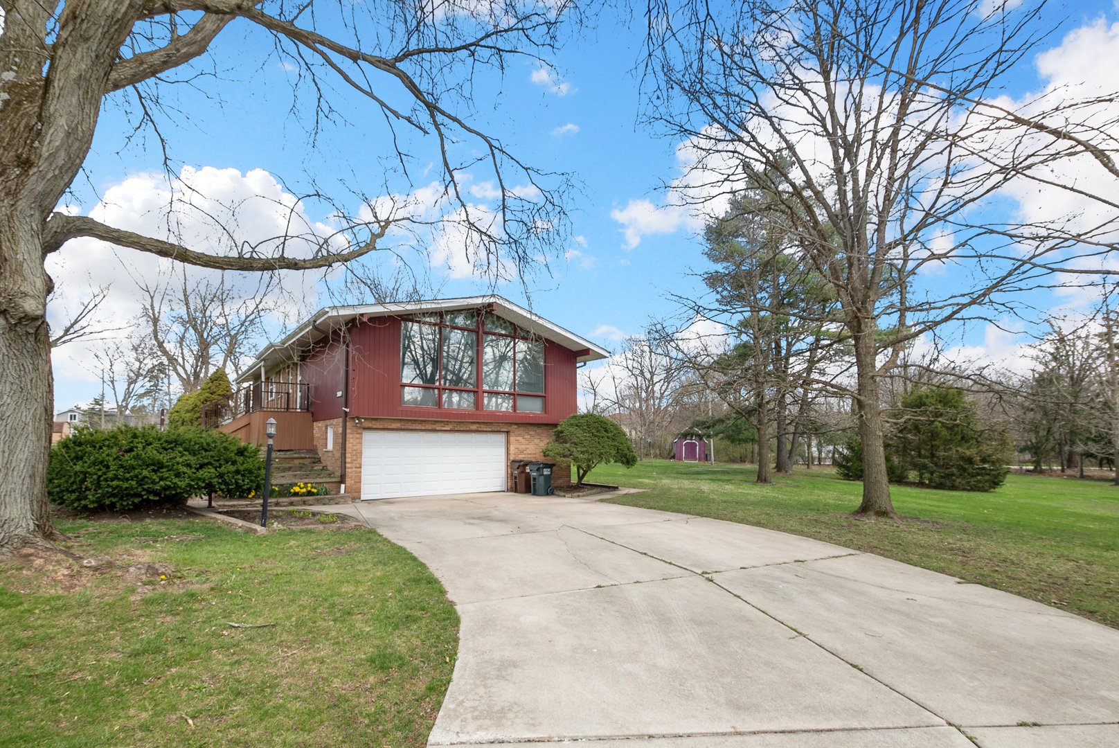 20009 East Brightway Road Mokena, IL 60448 - Photo 6 of 37 a front view of a house with a yard and garage
