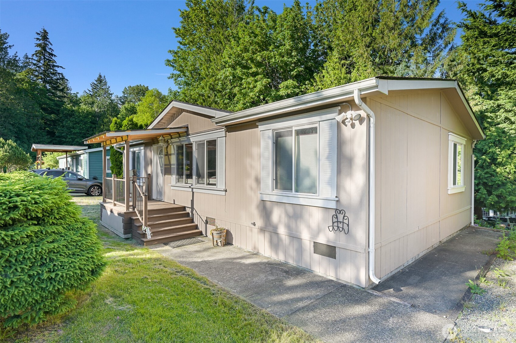 2174 Yew Street Road, Unit 22 Bellingham, WA 98229 - Photo 2 of 36 a front view of a house with a yard
